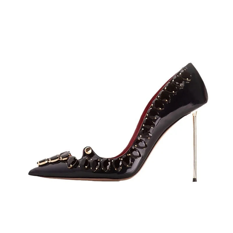 Black pointed-toe crystal heel pumps with high stiletto and decorative buckle detail