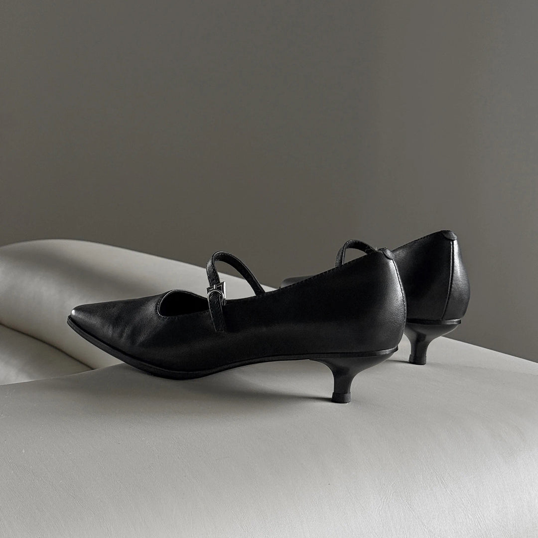 Black leather kitten heel pumps with pointed toe and ankle strap