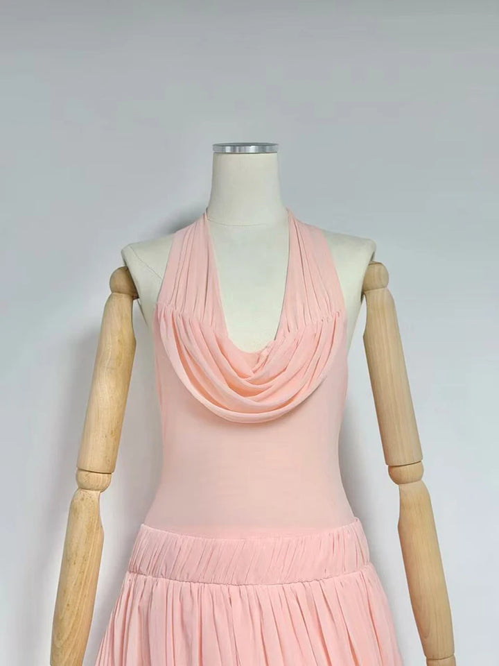 Pink pleated mini dress with draped cowl neckline and sleeveless flared skirt