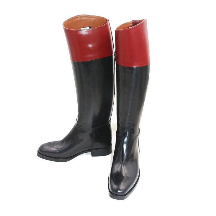 Knee-high riding boots with red upper and black glossy leather, pull-on style.