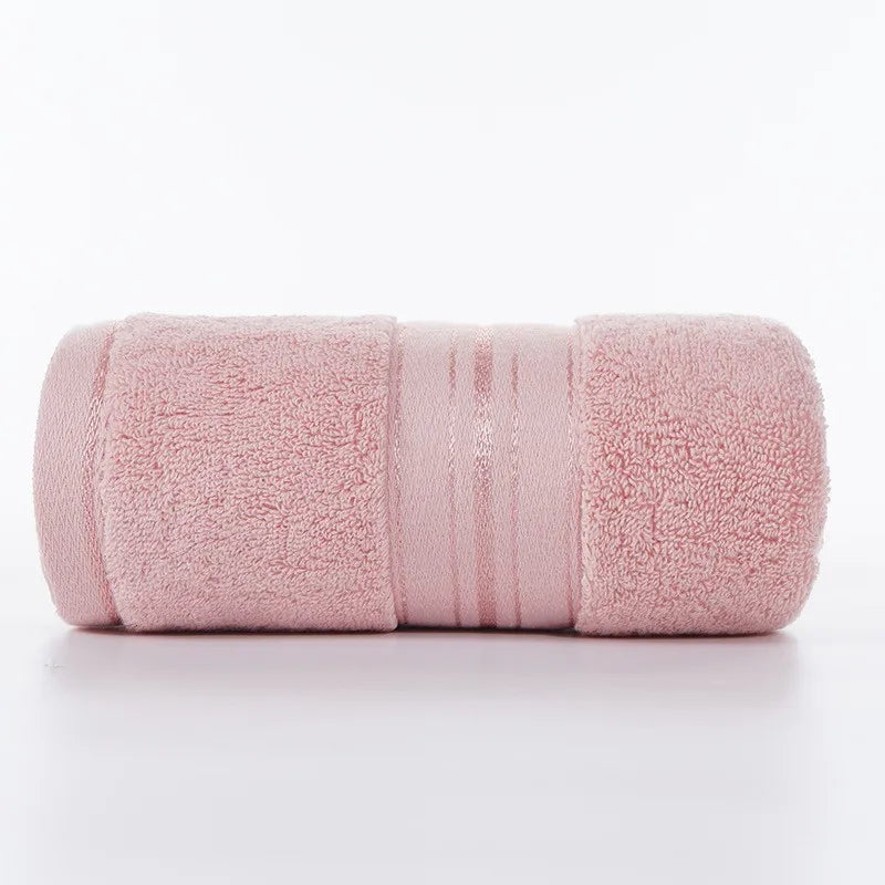 Pink face towel roll with stitched stripe bands and plush looped texture