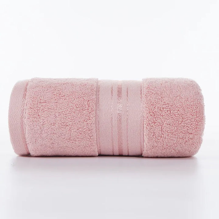 Pink face towel roll with stitched stripe bands and plush looped texture