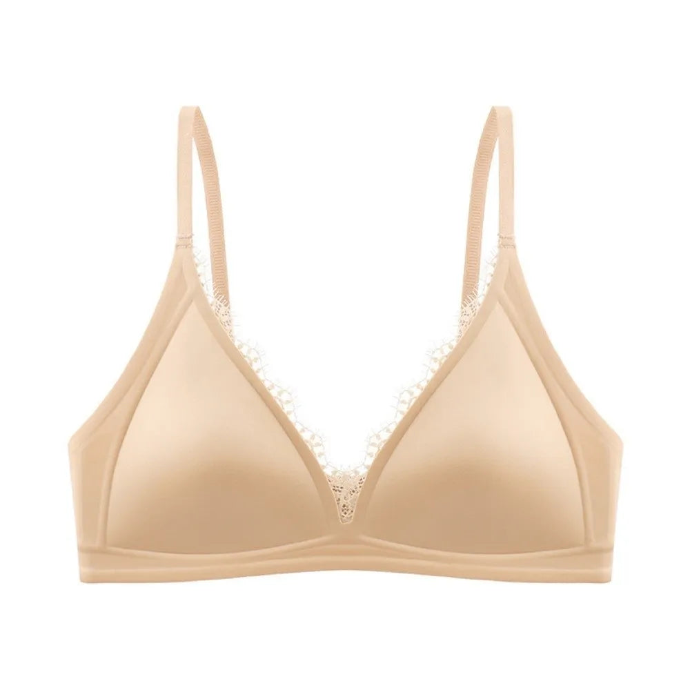 Nude wireless V-neck satin bra with lace trim and seamless, traceless straps.