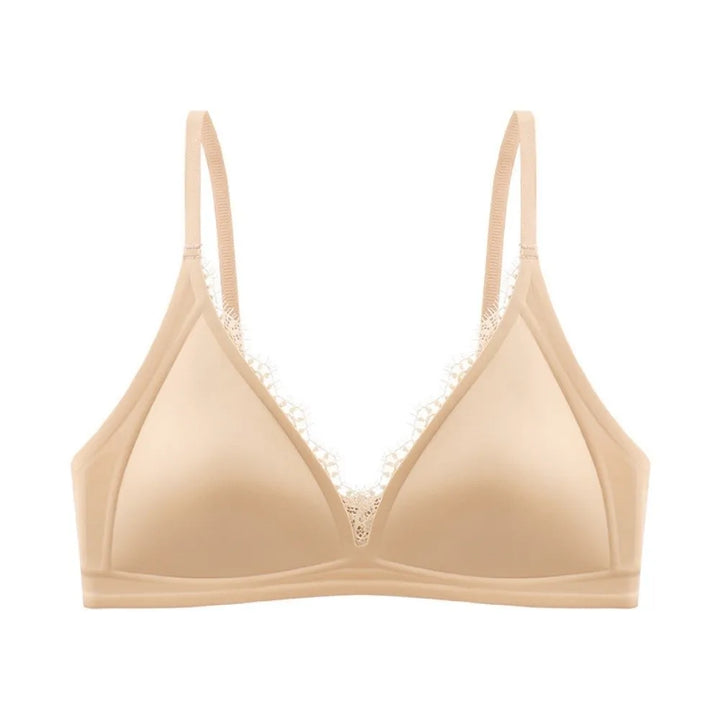 Nude wireless V-neck satin bra with lace trim and seamless, traceless straps.