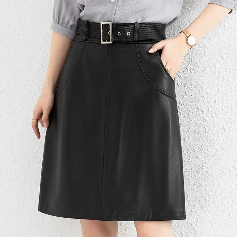 Black leather midi skirt with belt loops and front vertical seam details