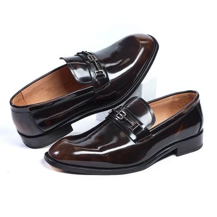 Brown pointed toe leather loafers with glossy finish and buckle strap