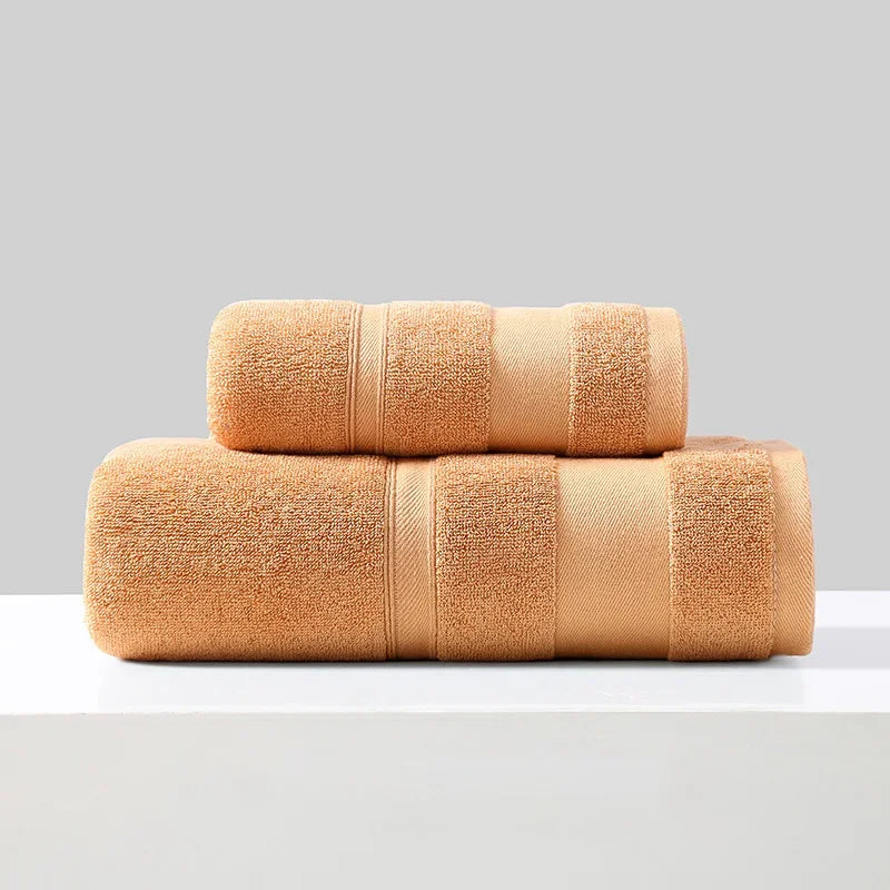 Cotton towel set of 2 in tan/orange, folded bath towels with stitched bands