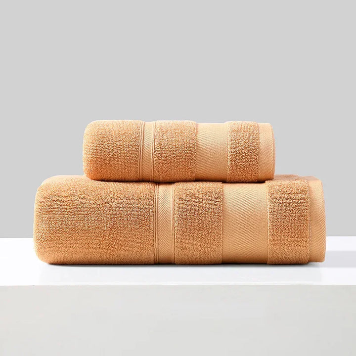 Cotton towel set of 2 in tan/orange, folded bath towels with stitched bands