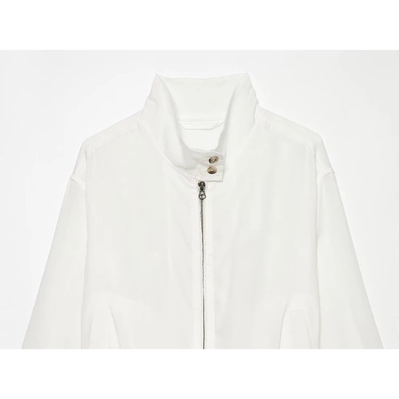 White women’s stand-collar zip-up jacket front with buttoned placket and zip pull
