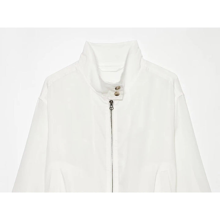 White women’s stand-collar zip-up jacket front with buttoned placket and zip pull