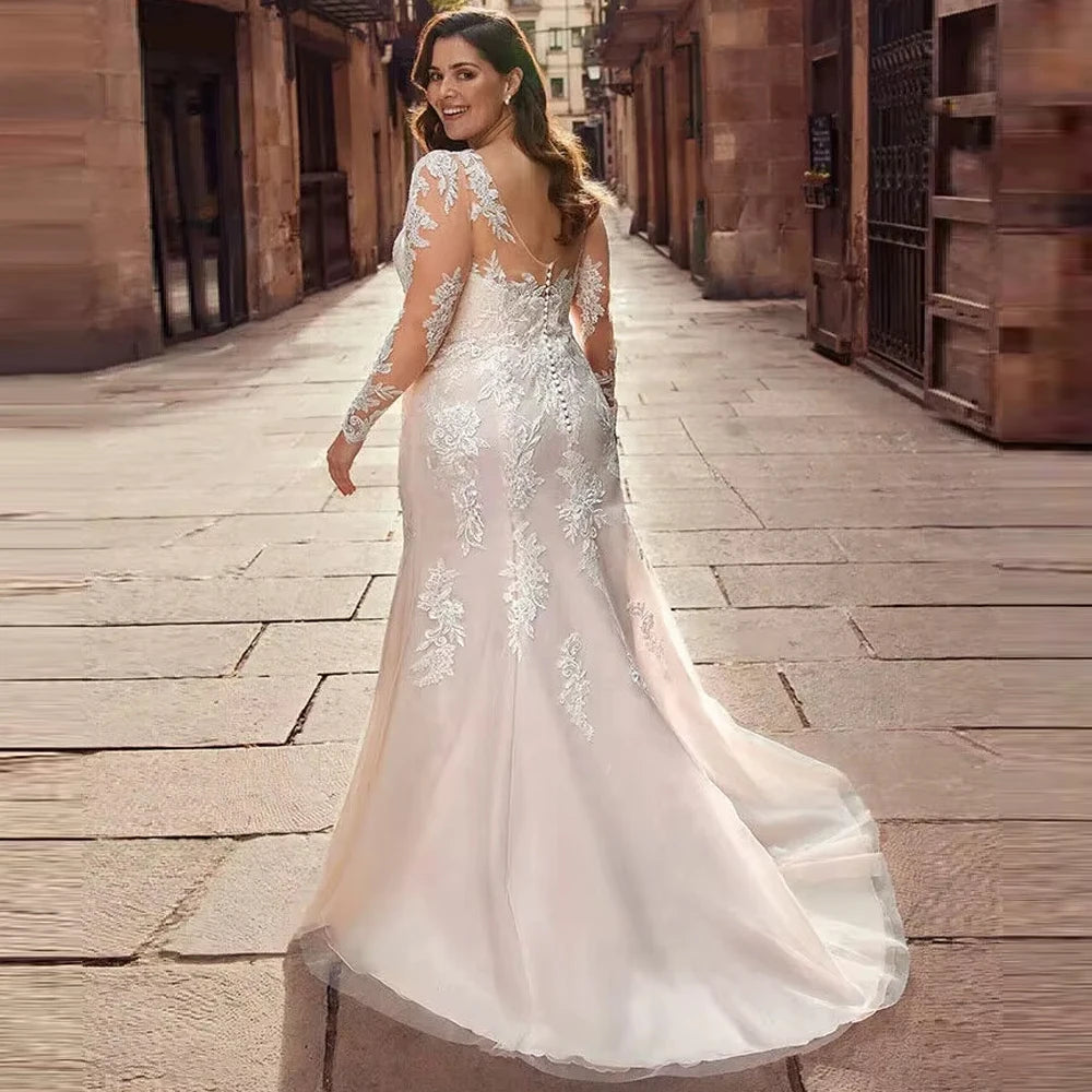Women's bridal ball gown with lace appliqué, long sleeves, and sheer back