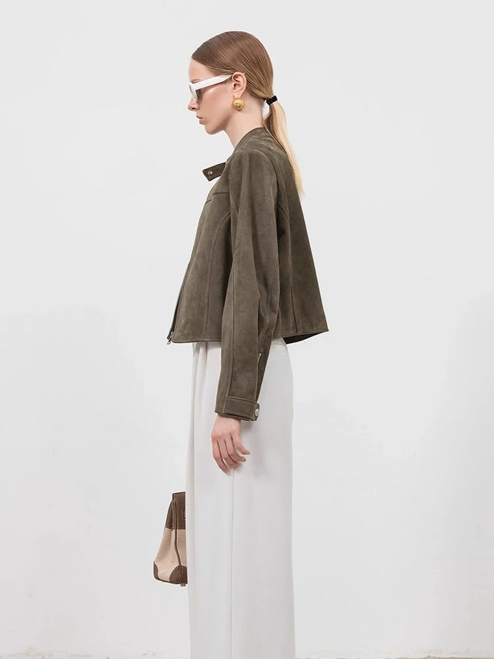 Gray-green suede cropped jacket in side profile with stand collar and long sleeves