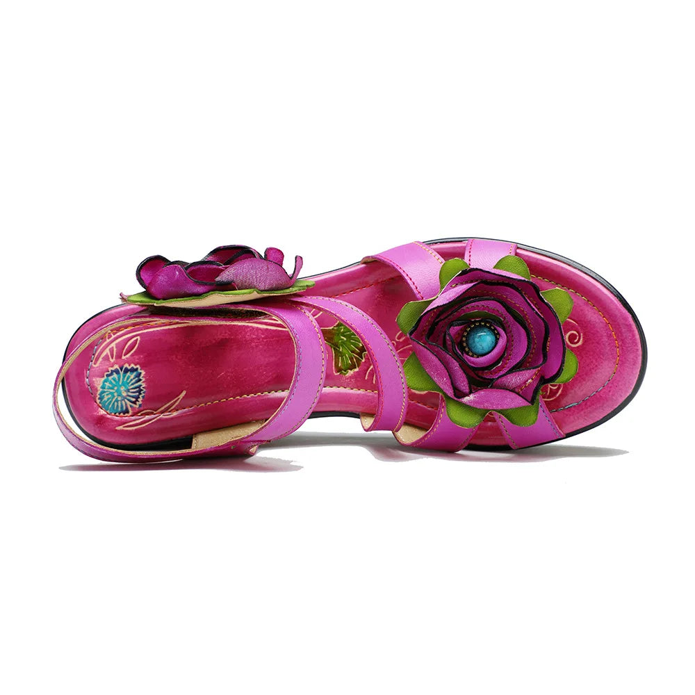 Women’s pink leather wedge sandals, side view, with rose flowers and embroidered floral accent