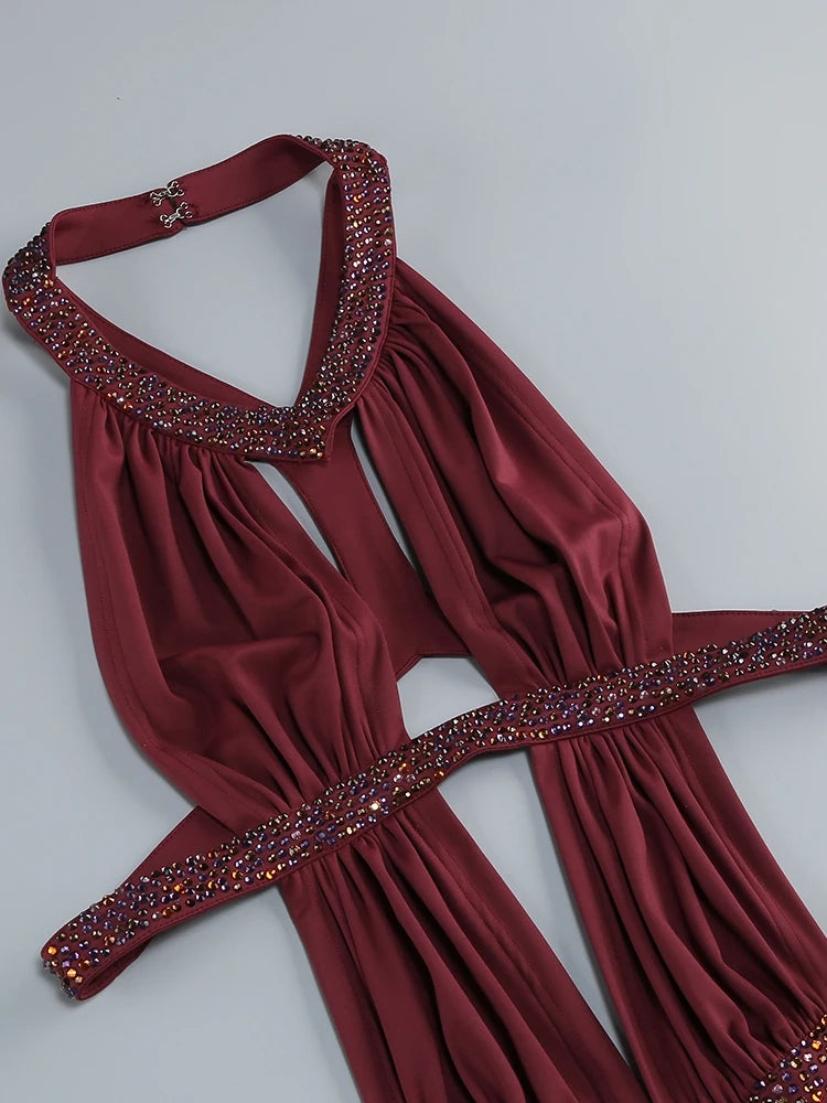 Burgundy halter mini gown flat lay with crystal trim and ruched skirt