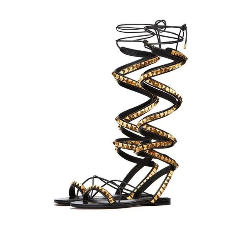 Women’s flat sandals with cross straps and gold-tone rivets