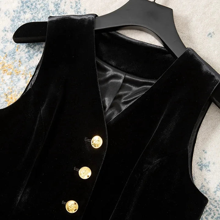 Black velvet sleeveless waistcoat on hanger, V-neck and gold button front