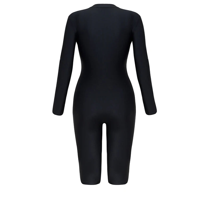 Women’s one-piece swimwear back view, black long sleeves and knee-length legs