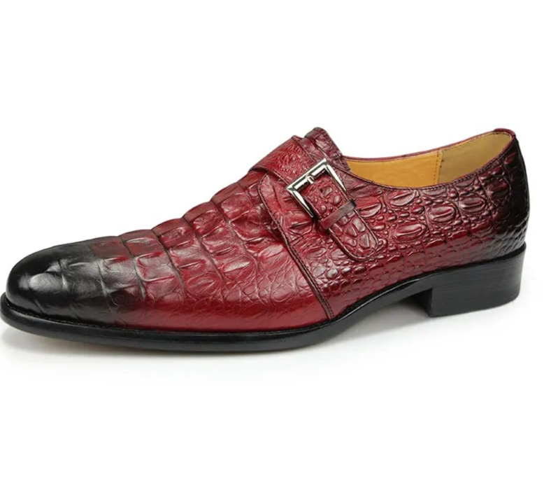 Set of four red dress shoes with black toes on a white background