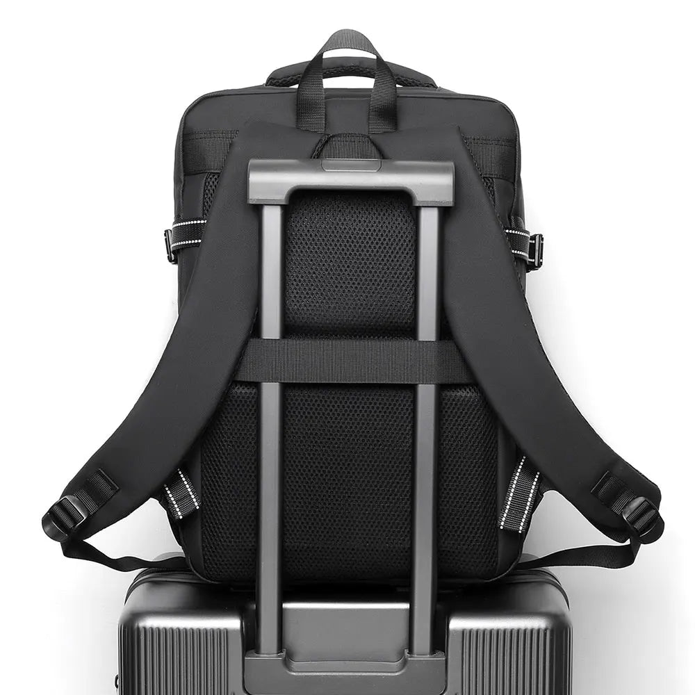 Back panel of black laptop backpack showing padded frame and mesh support sections