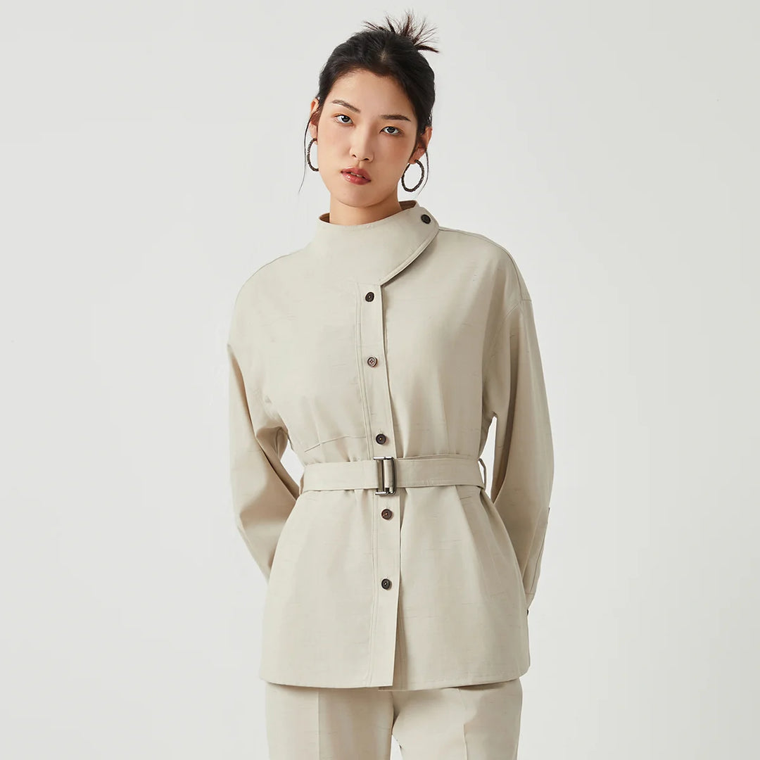 Wool slim trench coat, light cream, belted waist and buttoned center front.