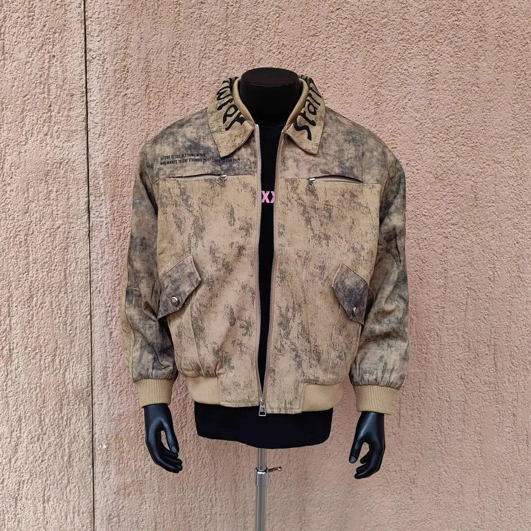 Men's lapel coat with distressed khaki beige print and lettered collar, zip front.