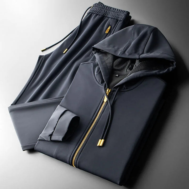 Navy zip-front hoodie and matching jogger pants with drawstring waistband