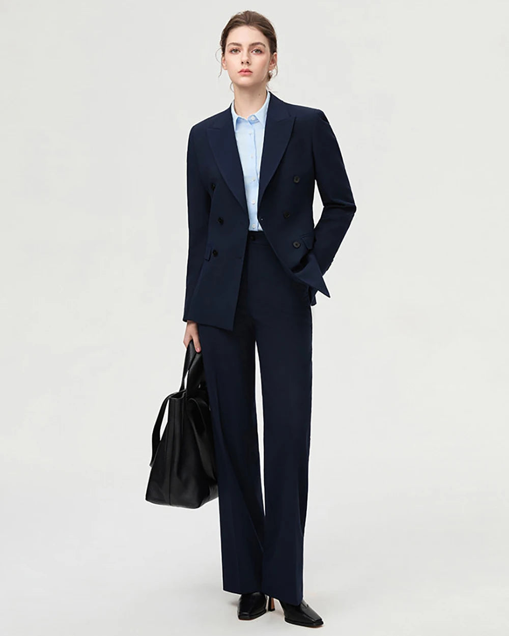 Women's navy two-piece blazer suit with double-breasted blazer and straight-leg pants