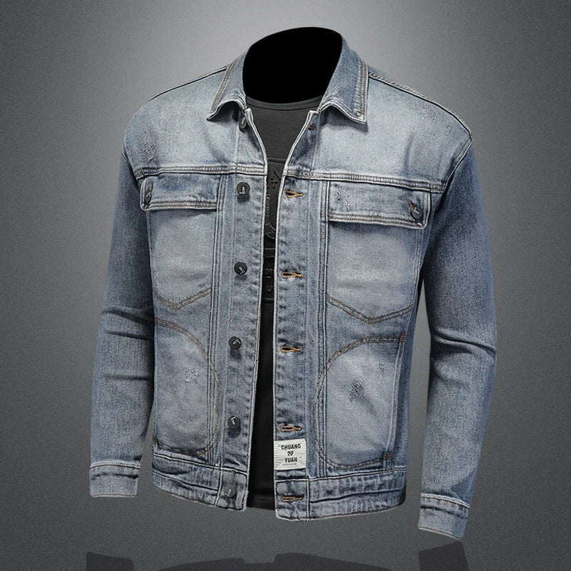 Light blue denim jacket with button front, spread collar, and two chest flap pockets