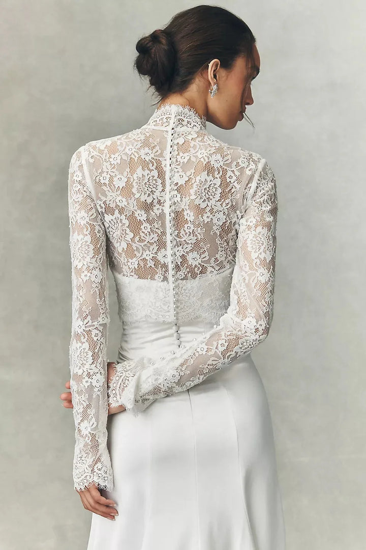 White lace bridal jacket with high neck and long sleeves, back view over fitted waist