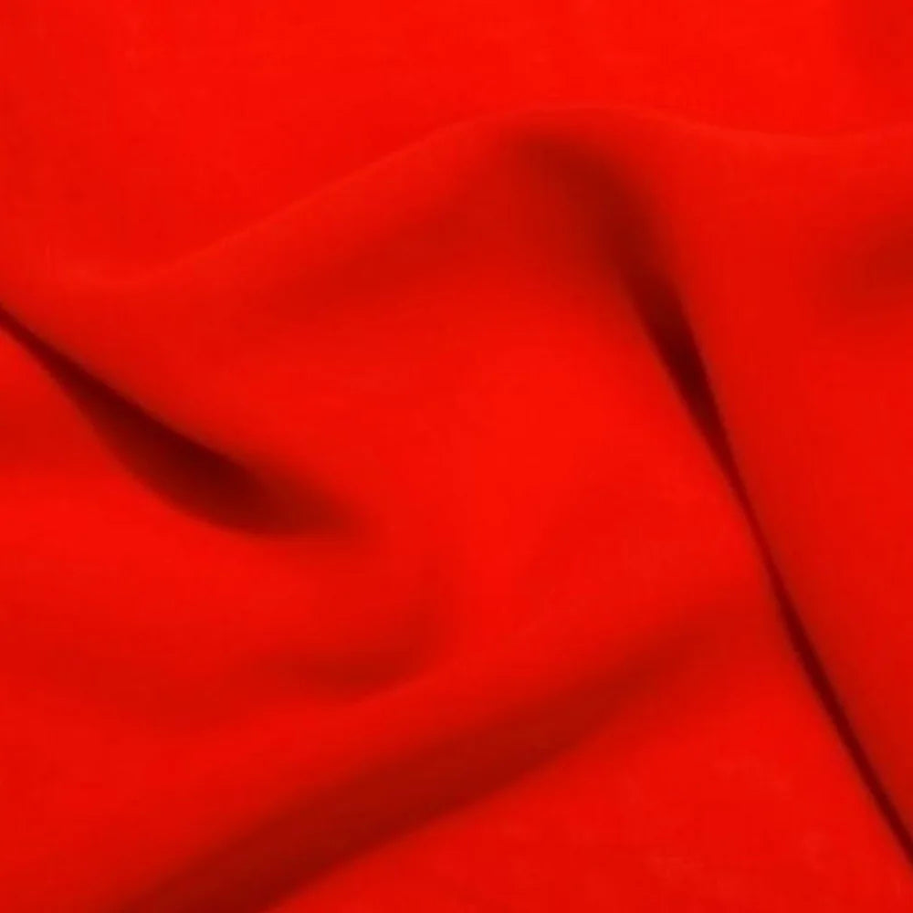 Red satin fabric close-up with smooth folds