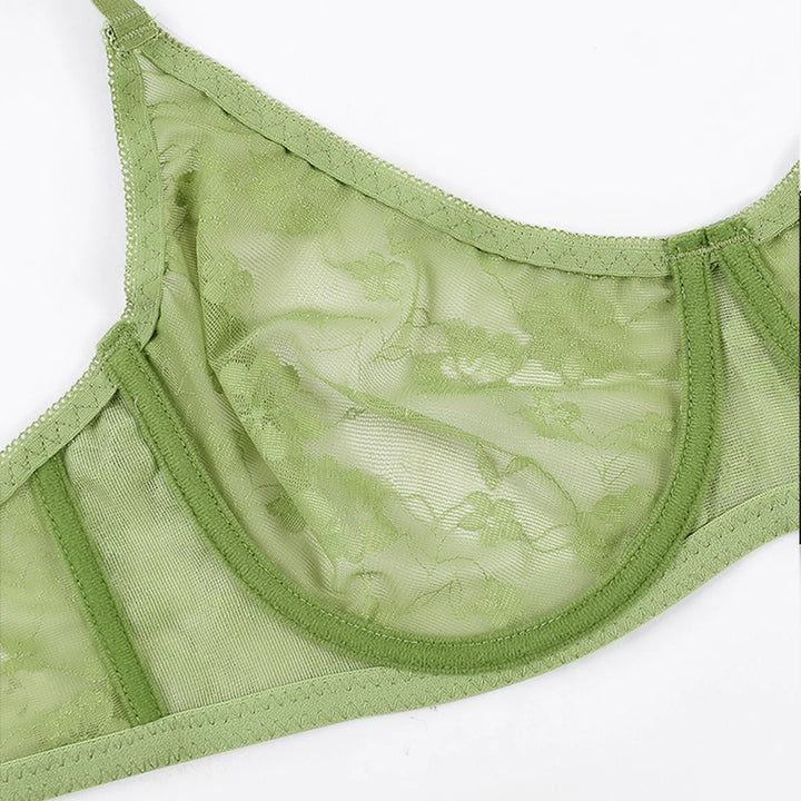 Green underwire lace bra, close-up of lace cups and neckline edge