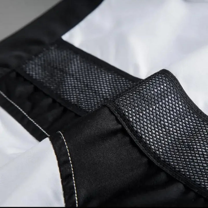 White shirt with black mesh side stripe and stitched seam detail near placket