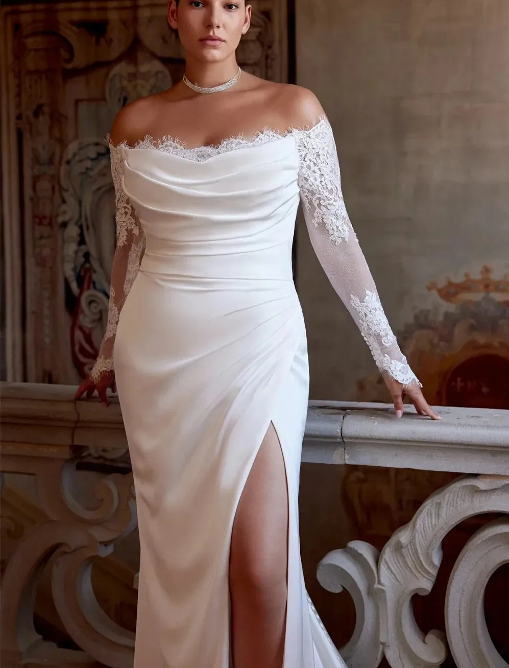 White satin off-shoulder bride gown with lace sleeves and side slit front
