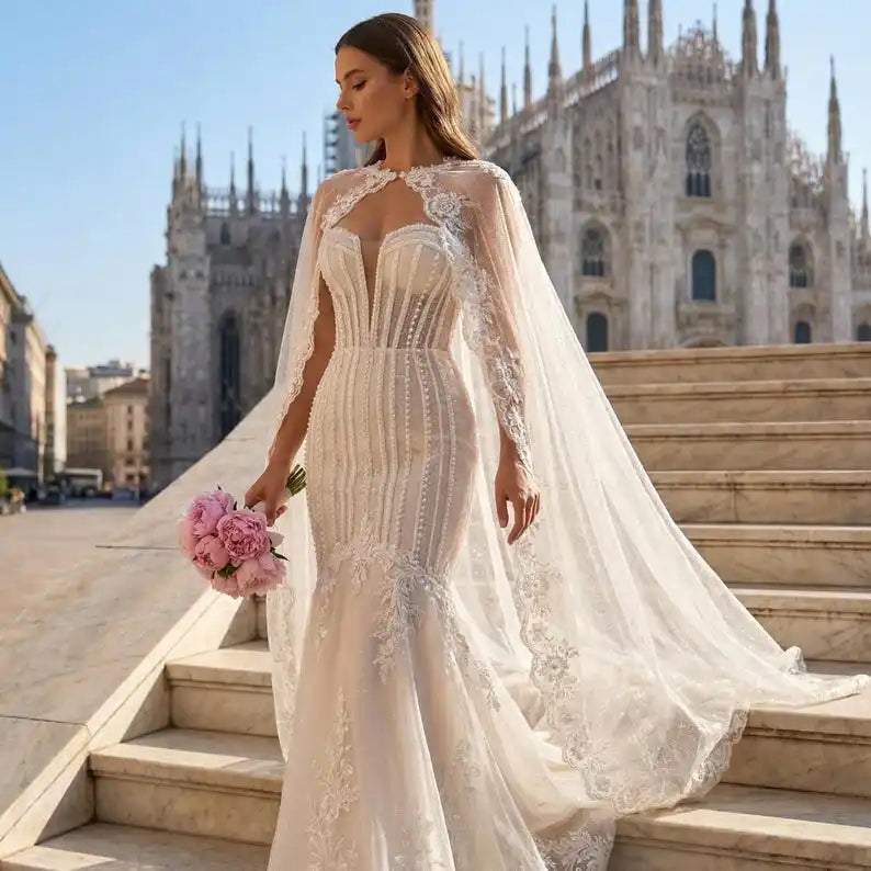 Ivory glitter tulle bridal cape with scalloped lace trim and long draped veil