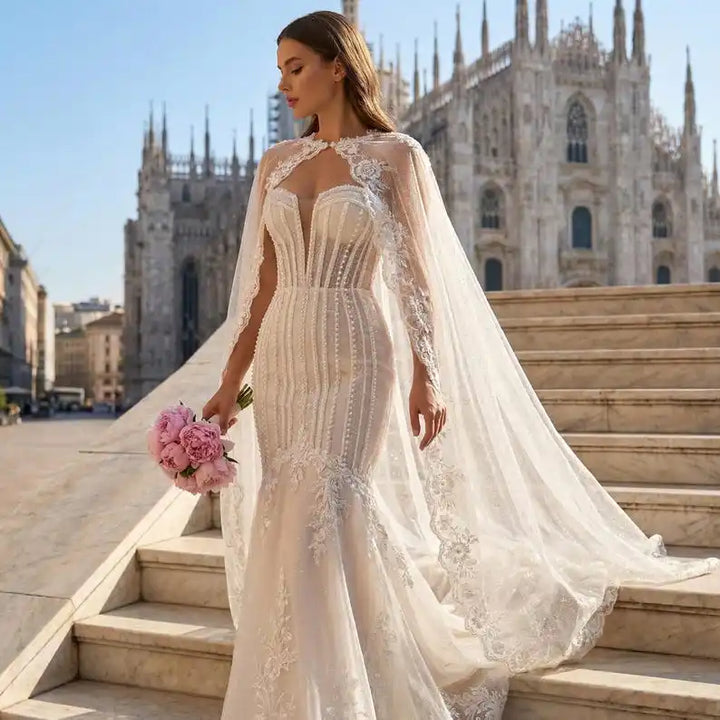 Ivory glitter tulle bridal cape with scalloped lace trim and long draped veil