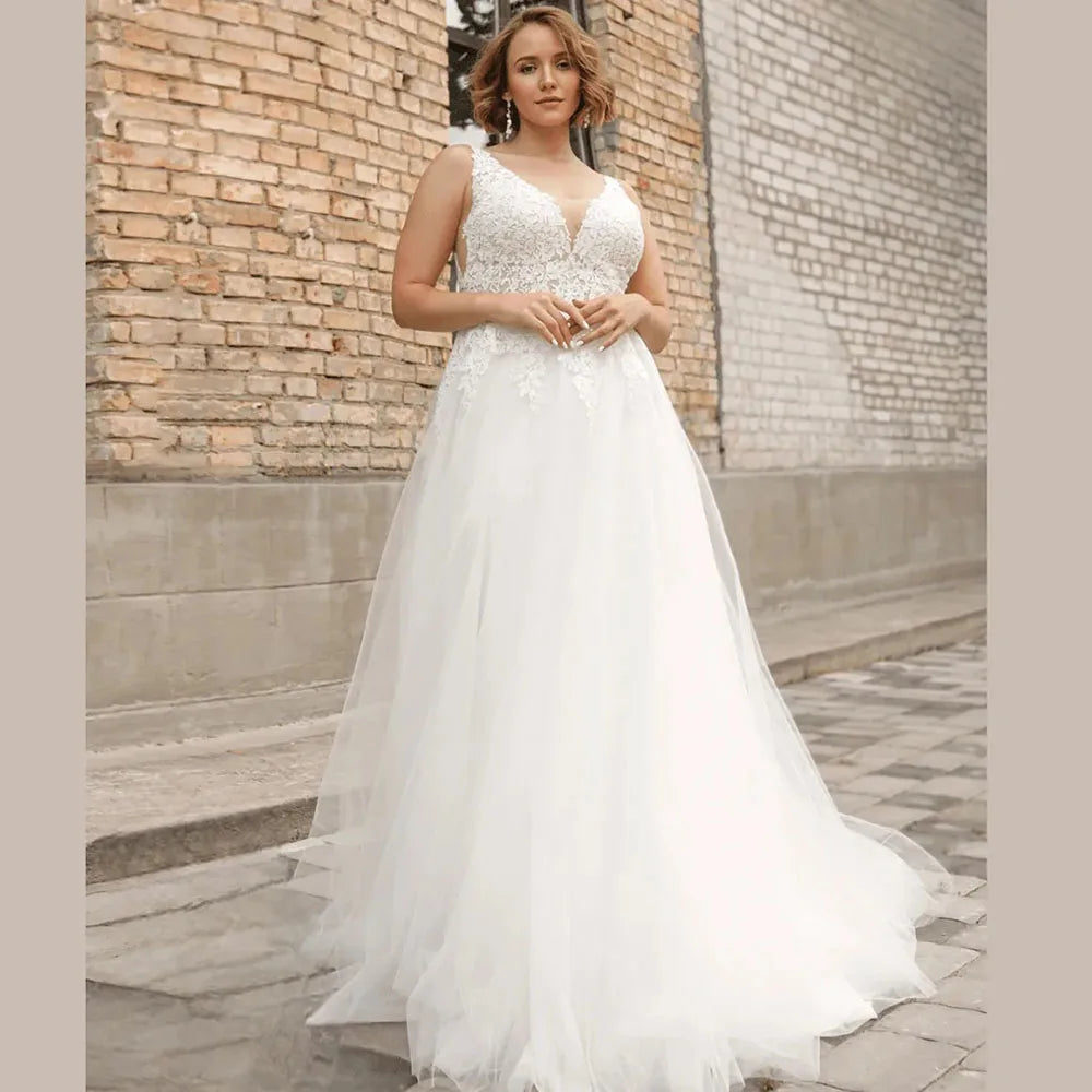 Classic plus size tulle wedding dress with lace V-neck bodice and flowing A-line skirt