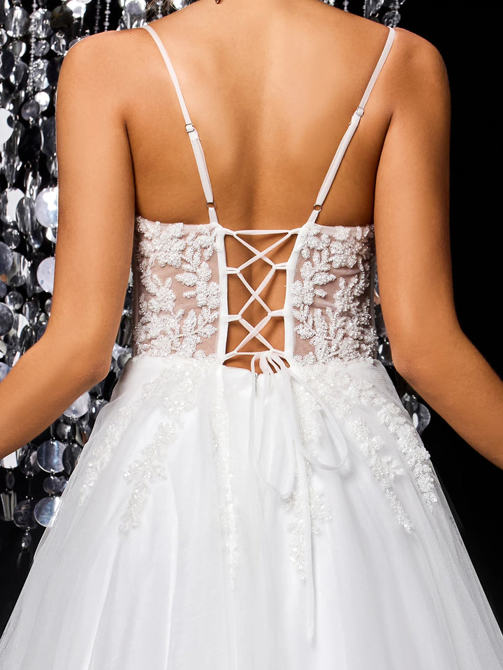 White lace tulle bridal gown open back with crisscross strap lattice detail
