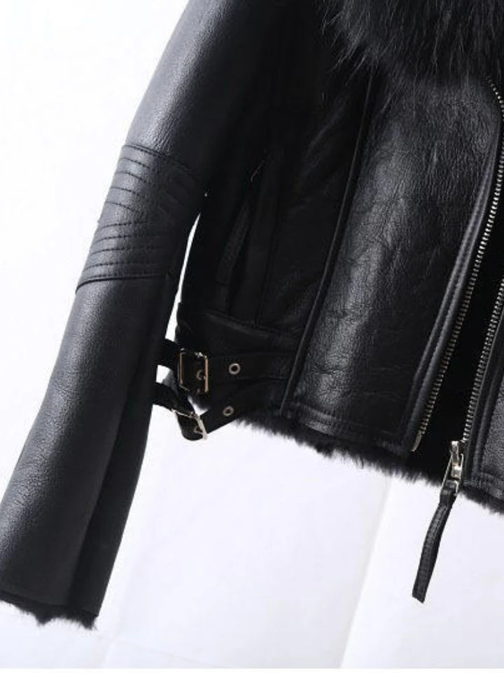 Black leather jacket sleeve detail with front zip and faux-fur trim
