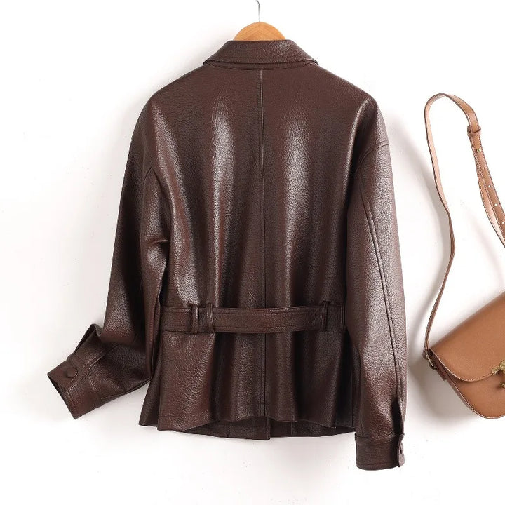 Brown leather women’s coat with stand collar, belt waist, flap pockets, button cuffs