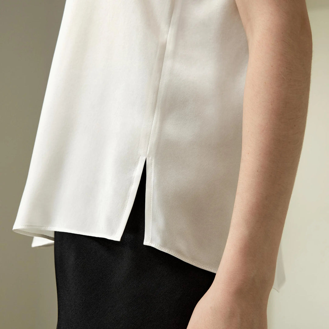 Women’s silk relaxed tank top side close-up, natural white with high-slit drape hem