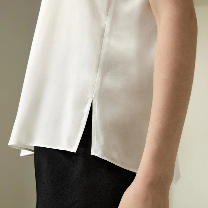 Women’s silk relaxed tank top side close-up, natural white with high-slit drape hem