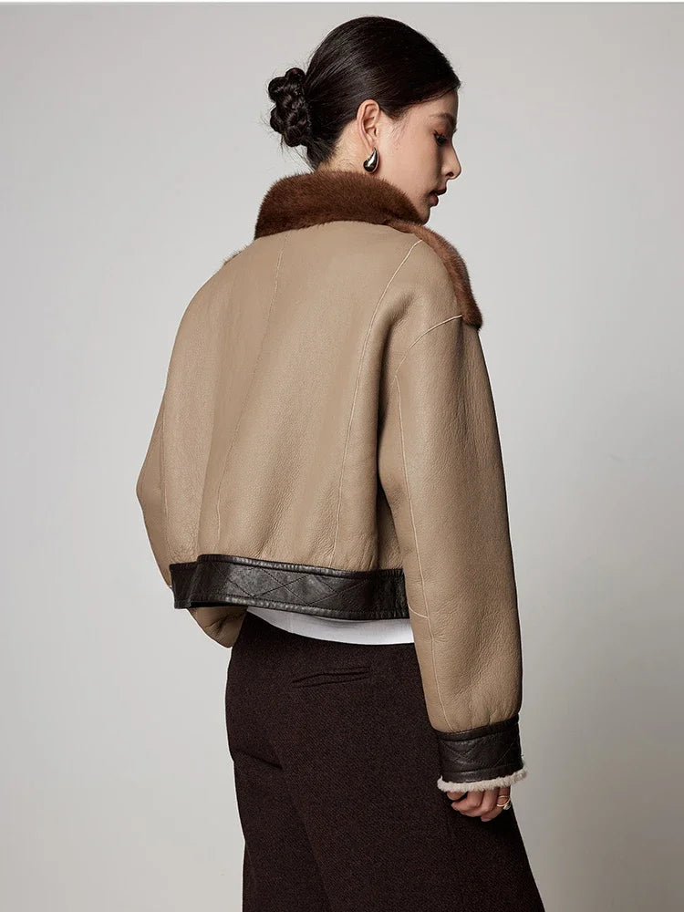 Women’s short mink fur jacket, back view, brown and tan panels with stand collar