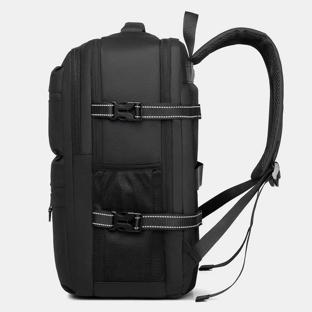 Black backpack back view with straps, side zip pocket, and reinforced handle