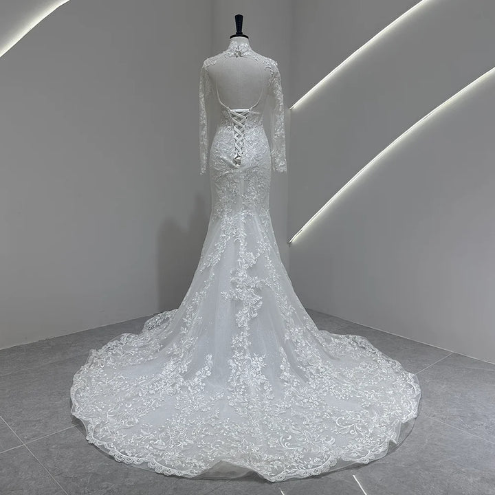 Ivory lace high-neck wedding gown with sheer long sleeves and corset-style open back