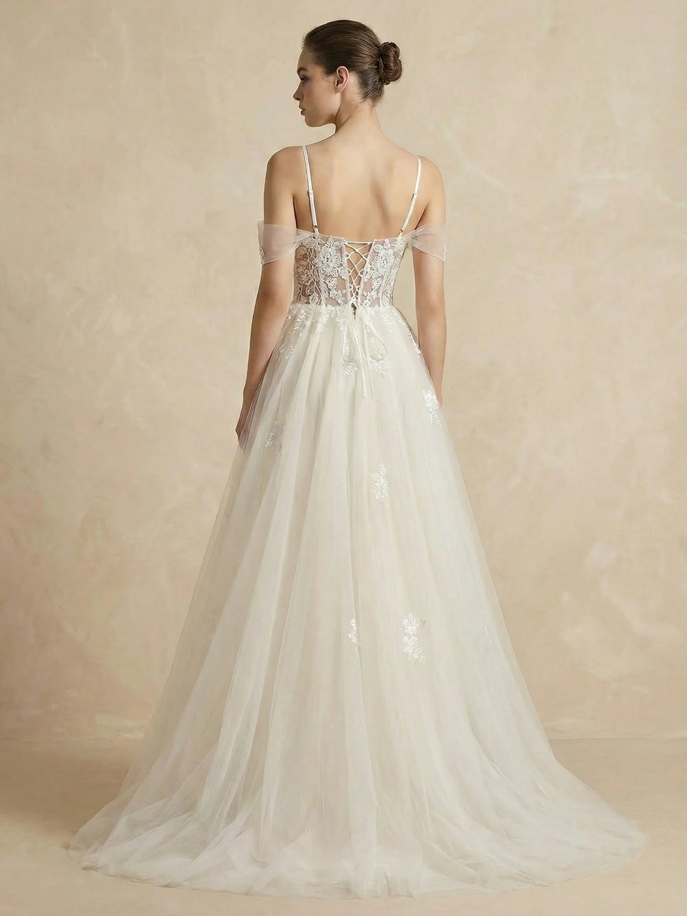 White mesh bridal dress back view with thin straps, lace bodice, long tulle skirt