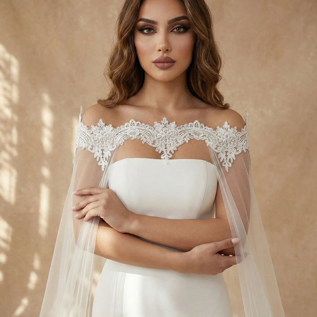 Off-white off-shoulder bridal bodice with floral lace trim and sheer veil drape