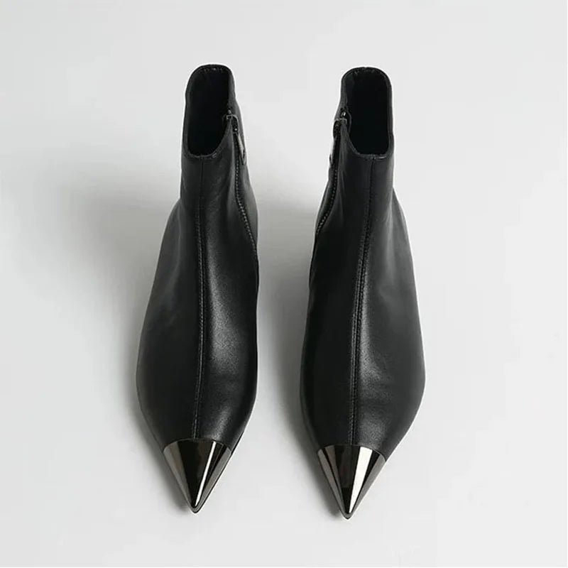 Black pointed-toe ankle heel boots, sleek side profile with tall shaft.
