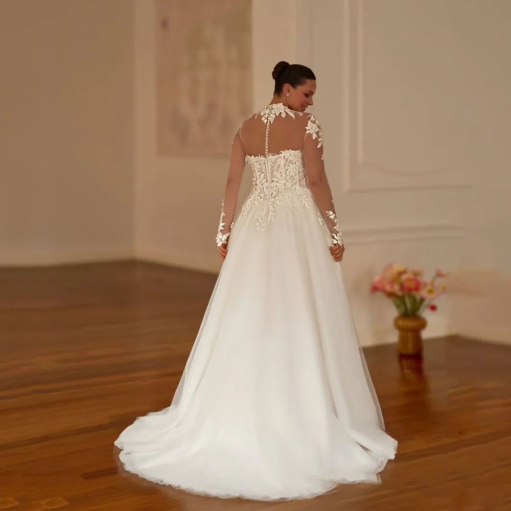 Back view of off-shoulder lace bridal dress with open back and full flowing skirt