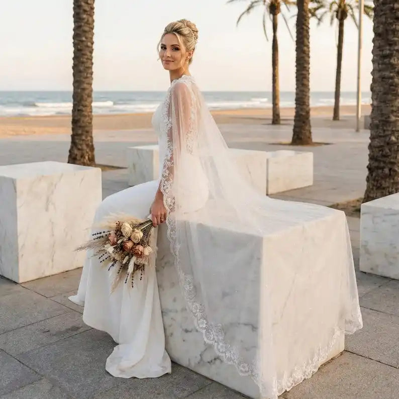 Ivory glitter bridal cape with lace border and long sheer veil for weddings