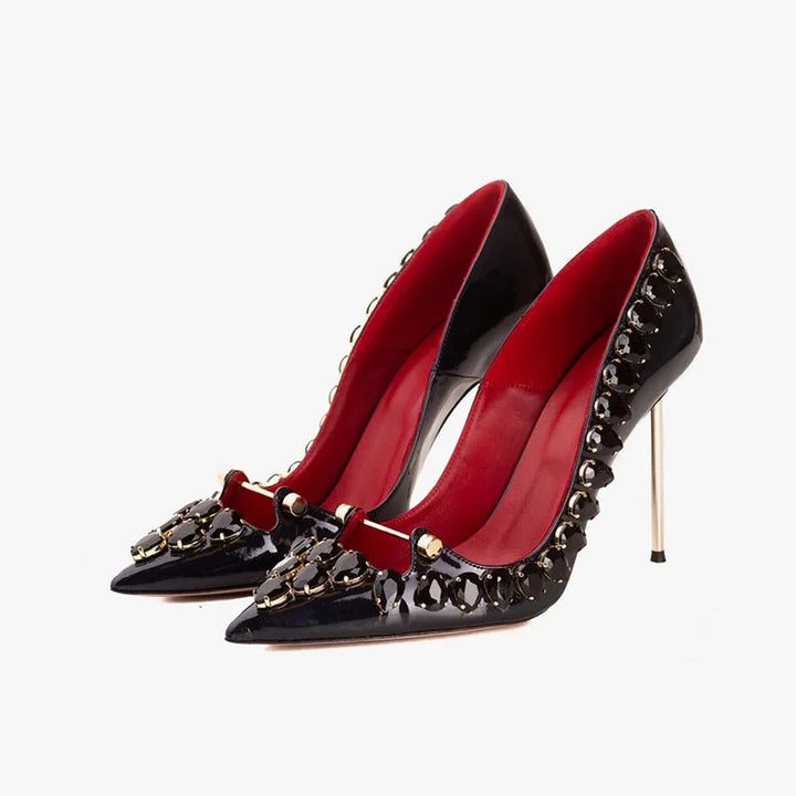 Pair of black pointed-toe crystal heel pumps with red inner lining and high stiletto